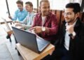 Group of four indian teen male students. Classmates spend time t