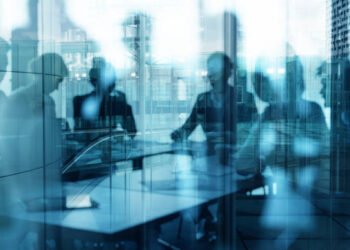 Double exposure of business people who work together in office