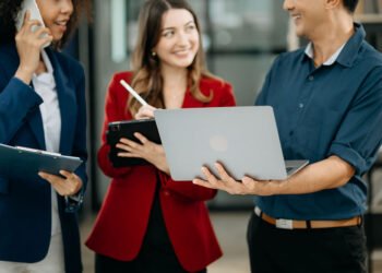 Happy businesspeople while collaborating on a new project in an