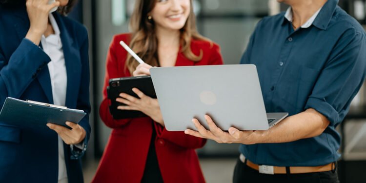 Happy businesspeople while collaborating on a new project in an